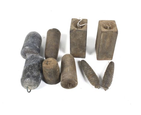 A collection of assorted sets of vintage clock weights. Of various sizes and designs