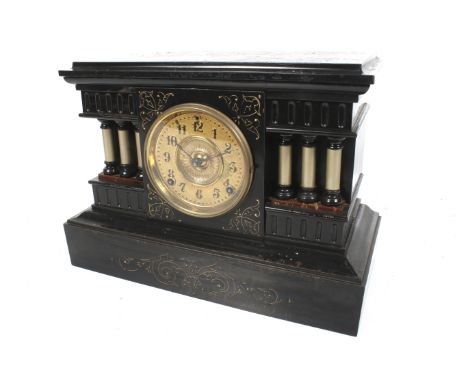 A vintage Ansonia USA black painted metal cased clock. Striking to a gong. With a gilt metal dial, painted Arabic numerals an