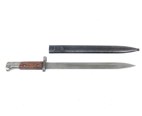A WW2 Czechoslovakian bayonet. Blade length 30cm, the ricasso stamped CSZ/C, with a wooden grip, the metal scabbard marked E3