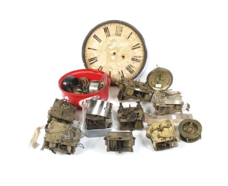 A collection of assorted vintage clock parts and spare mechanisms. Including movements, dials, escapements, etc.