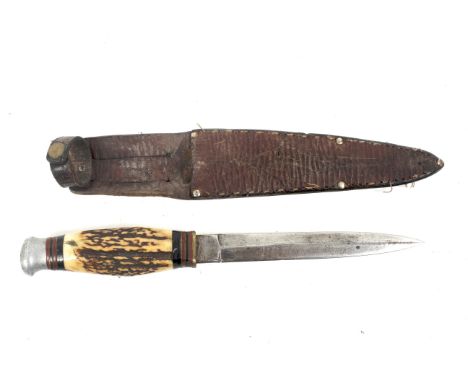 A 20th century single blade knife. Blade length 14cm, with a horn grip, within a brown leather scabbard