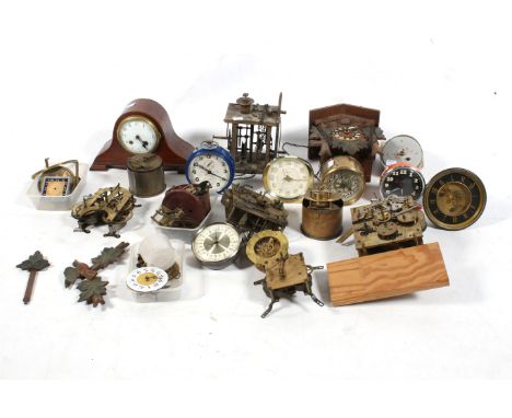 A collection of assorted vintage clock mechanisms. Including alarm clocks, movements, cases, etc.