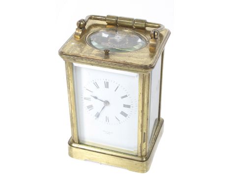 A French 19th century repeater brass carriage clock. With a white enamel dial inscribed 'Hall & Co., Paris', #2862. H13.5cm