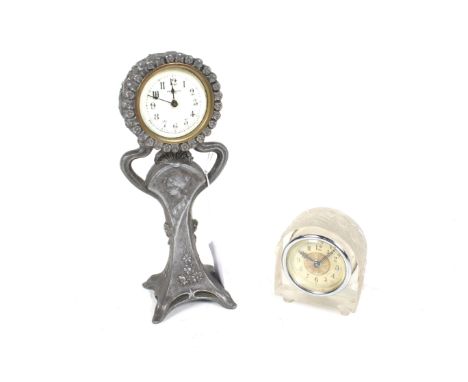 Two assorted small mantel clocks. Including New Haven USA cast metal Art Nouveau style pewter pedestal clock with white ename