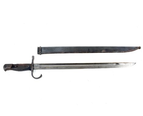 A Japanese WWII Arasaki bayonet. Blade length 39.8cm, the ricasso marked with the Tokyo Arsenal Foundry mark, with a wooden g