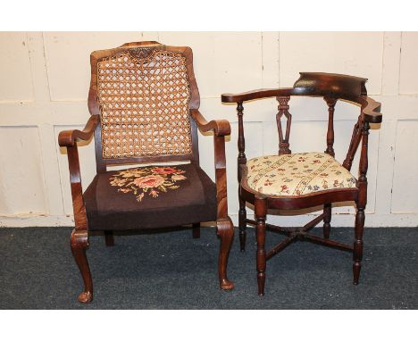 A bow-shaped corner armchair on turned and pierced supports, and a cane backed open armchair with tapestry seat