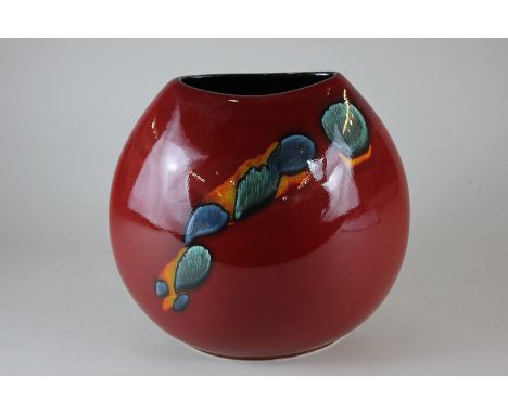 A Poole Pottery globular vase in red, orange and turquoise colours, 26cm high