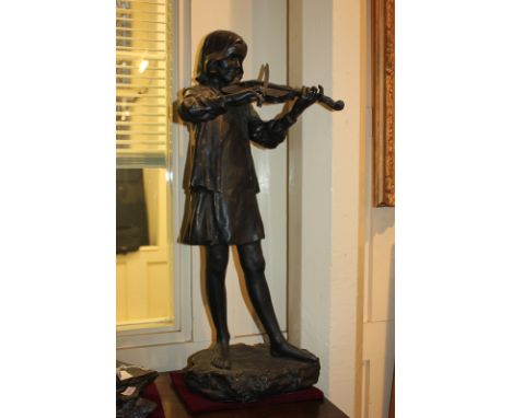 A 20th century matte bronze glazed and waxed slip cast ceramic sculpture, of a girl playing violin by Walter Awlson