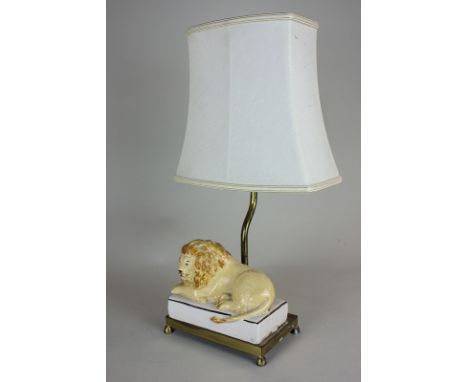 A ceramic and gilt metal table lamp with figure of a recumbent lion, 16cm wide