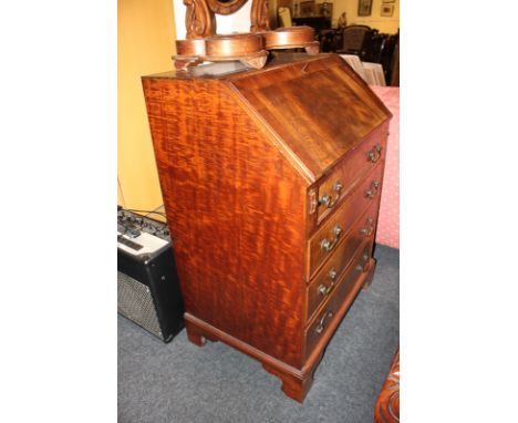 A 20th century mahogany bureau with cross  banded fall, four drawers, on bracket feet, 69cm