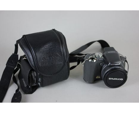 An Olympus SP-55on2 digital camera in case