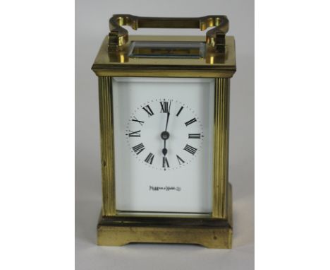 A Mappin and Webb brass and bevelled glass cased carriage clock, 15cm high