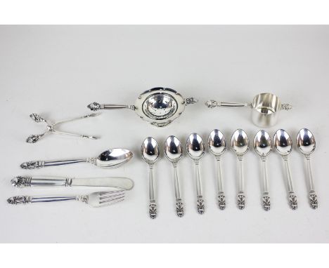 Georg Jensen, acorn pattern sterling silver, comprising a tea strainer and stand, a jigger, tongs, eight coffee spoons and a 