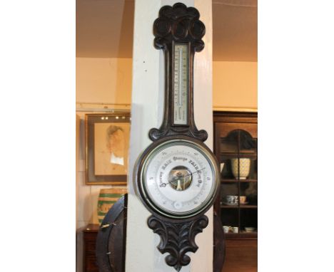 A carved oak cased banjo barometer with thermometer, 82cm