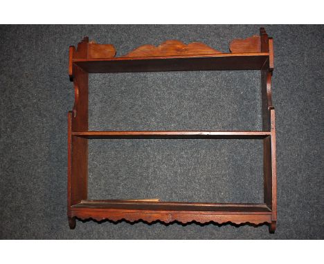 A Victorian wall shelf with fret cut top rail, side supports and base, 59cm