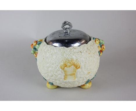 A Clarice Cliff Celtic Harvest Newport pottery jar and cover, with fruit and wheat sheaf design