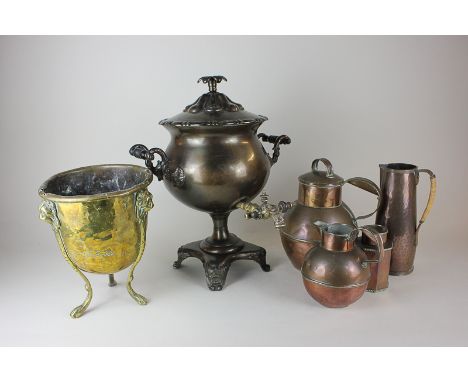 A collection of copper and metalware, comprising three copper jugs and a tea caddy, a brass jardiniere and a samovar