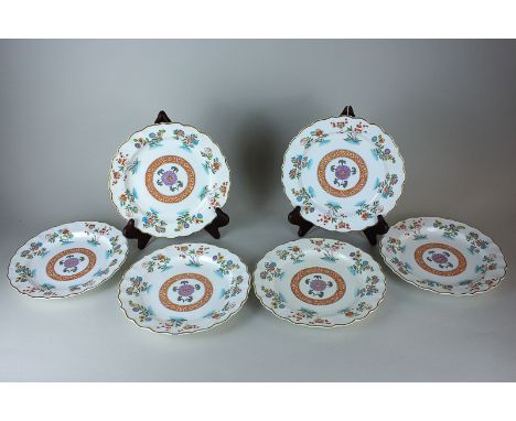 A set of six Royal Worcester dessert plates, retailed at Matlock's, London, with scalloped borders and Japanese floral design