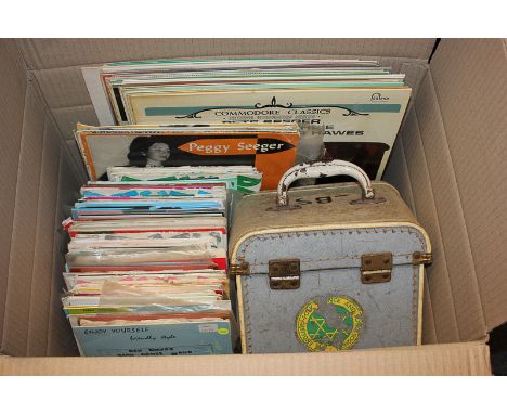 A collection of folk music records, long playing and singles, including Pete Seeger
