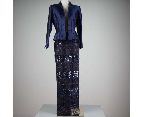 Elegant and refined, this Liancarlo Couture ensemble features a tailored navy silk jacket with structured seams, fabric-cover