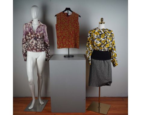 An elegant collection of four vintage designer garments made of luxurious silk, each highlighting the craftsmanship and signa