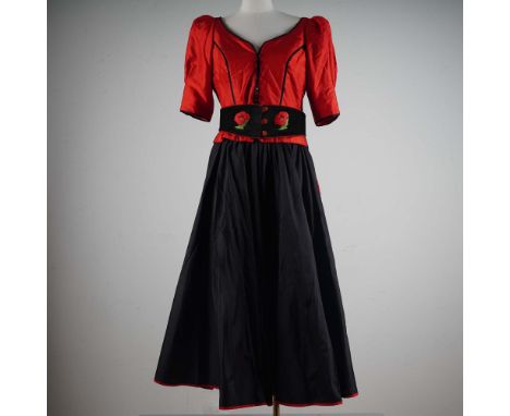 This striking three-piece ensemble by Caroline Charles London features a vivid red silk top with elegant black piping and a r