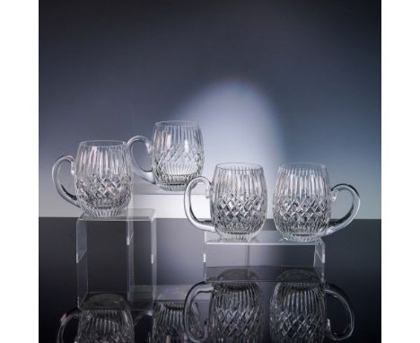 This set of four Tyrone crystal 1/2 pint tankards features classic star-cut bases and traditional diamond and vertical cuttin