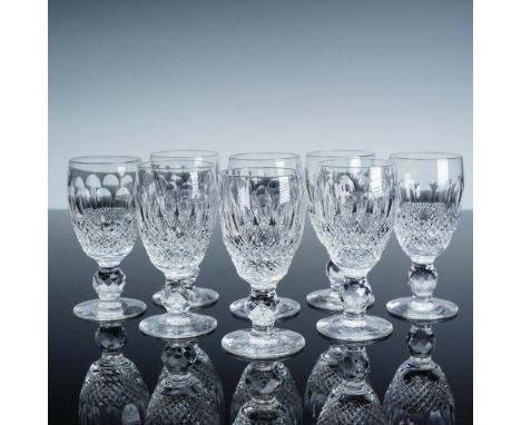 A refined set of eight Waterford crystal white wine glasses in the esteemed Colleen pattern, each featuring a brilliant blend