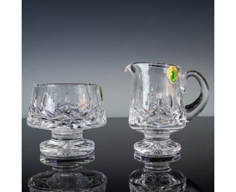 Set of two Waterford crystal pieces in the classic Lismore pattern, comprising one footed creamer and one open footed sugar b