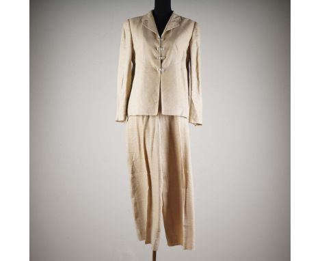 Elegant Valentino Boutique vintage women's two-piece skirt suit in a light cream raw silk blend, featuring a fitted jacket wi