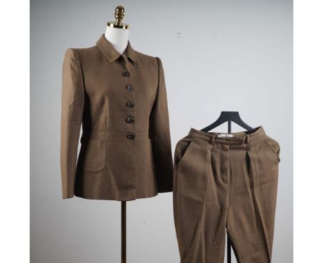 This sophisticated wool suit from Valentino Miss V features a tailored jacket with a collared neckline, structured shoulders,