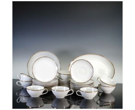 This elegant 34-piece dinnerware set by Royalton China Co. features classic translucent porcelain crafted in Japan, known for