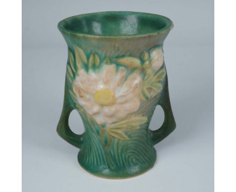 This Roseville Pottery vase in the Peony pattern, shape number 574, features a richly textured design of blooming peony bloss