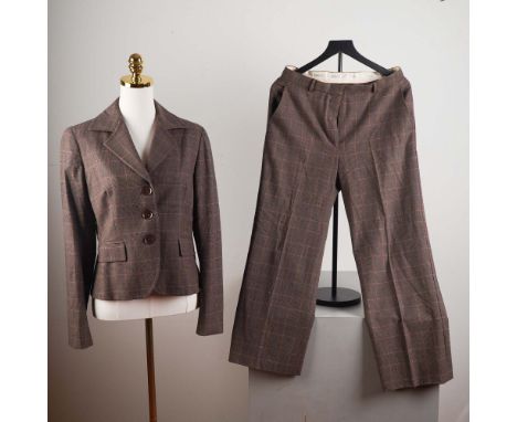 This sophisticated Max Mara vintage pant suit includes a structured three-button blazer and matching wide-leg trousers in a b