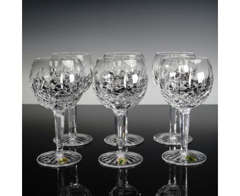 This elegant 6-piece set of Waterford Crystal balloon wine glasses features the iconic Lismore pattern, characterized by its 