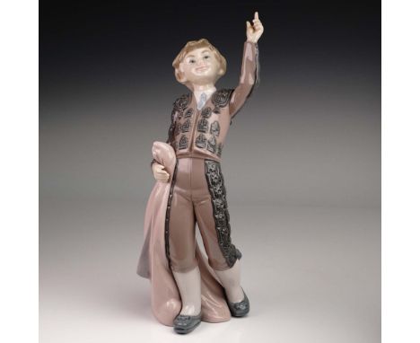 Lladro figurine model 01005116, A Victory, portrays a jubilant young matador mid-celebration, his expression bright and one a