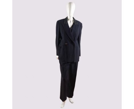This sophisticated three-piece ensemble from Akris, made in Switzerland, showcases impeccable tailoring and timeless elegance