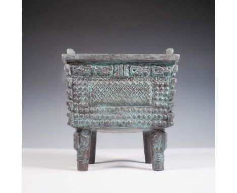 Inspired by the ancient Chinese fang ding ritual food vessels, this decorative piece features a rectangular form with four le