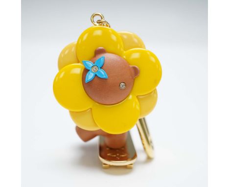 Features the iconic Vivienne character riding a skateboard. The design showcases a playful figure with a bright yellow flower