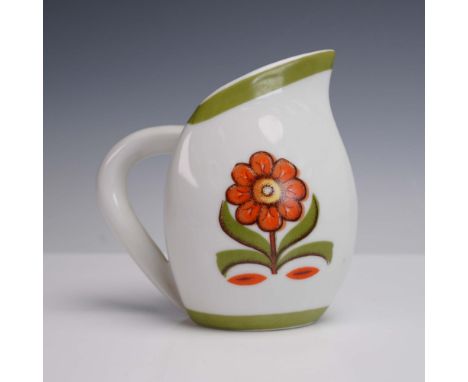 This vibrant porcelain pitcher showcases a mid century modern design with a distinctive curved form. Featuring a stylized ora