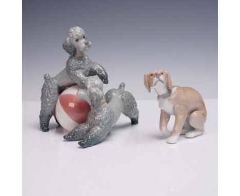 This two-piece set of Lladro porcelain figurines features the delightful Playing Poodles (model 01001258), depicting two anim