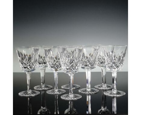 A set of eight Waterford crystal claret wine glasses in the timeless Lismore pattern, featuring elegant diamond and wedge cut