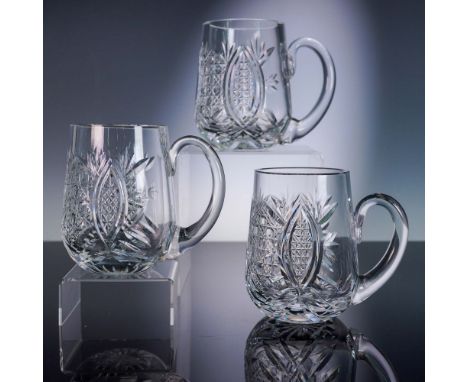 These elegant crystal tankards by Waterford feature classic cut glass patterns with fan and diamond motifs that beautifully c