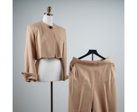 This sophisticated two-piece ensemble by Gianfranco Ferre, made in Italy, features a cropped jacket and matching high-waist t