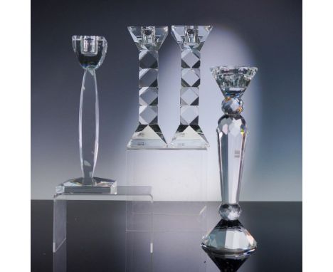 This elegant 4-piece set of crystal candlestick holders showcases refined geometric styling and multifaceted brilliance. Incl