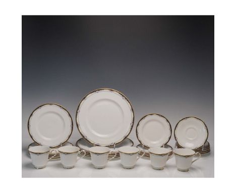 This 30-piece Royal Doulton English fine bone china dinnerware set features the Rhodes pattern (H.5099), produced in 1985. Ea
