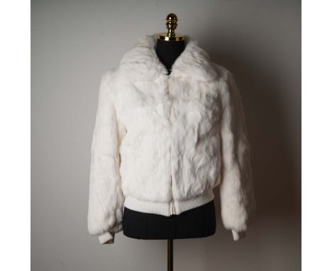 This striking white bomber-style jacket is crafted from luxuriously soft dyed rabbit fur and offers both warmth and high-fash
