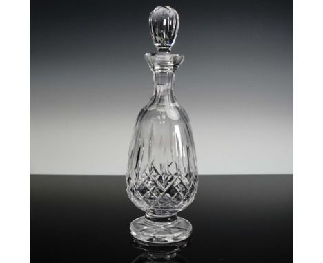 Brilliantly crafted Waterford crystal decanter featuring an elegant footed base and a faceted teardrop-shaped stopper. This p