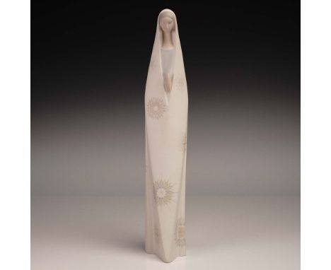 This serene Lladro porcelain figurine, number 1014586, features a stylized Madonna figure in a minimalist, elongated form wit