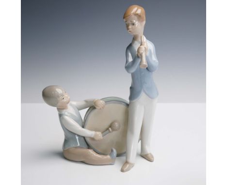 Crafted by Lladro and sculpted by Juan Huerta, this porcelain figurine titled Group of Musicians (Grupo de Musicos) portrays 